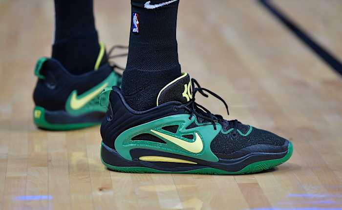 View of Kevin Durant's black and green Nike shoes.